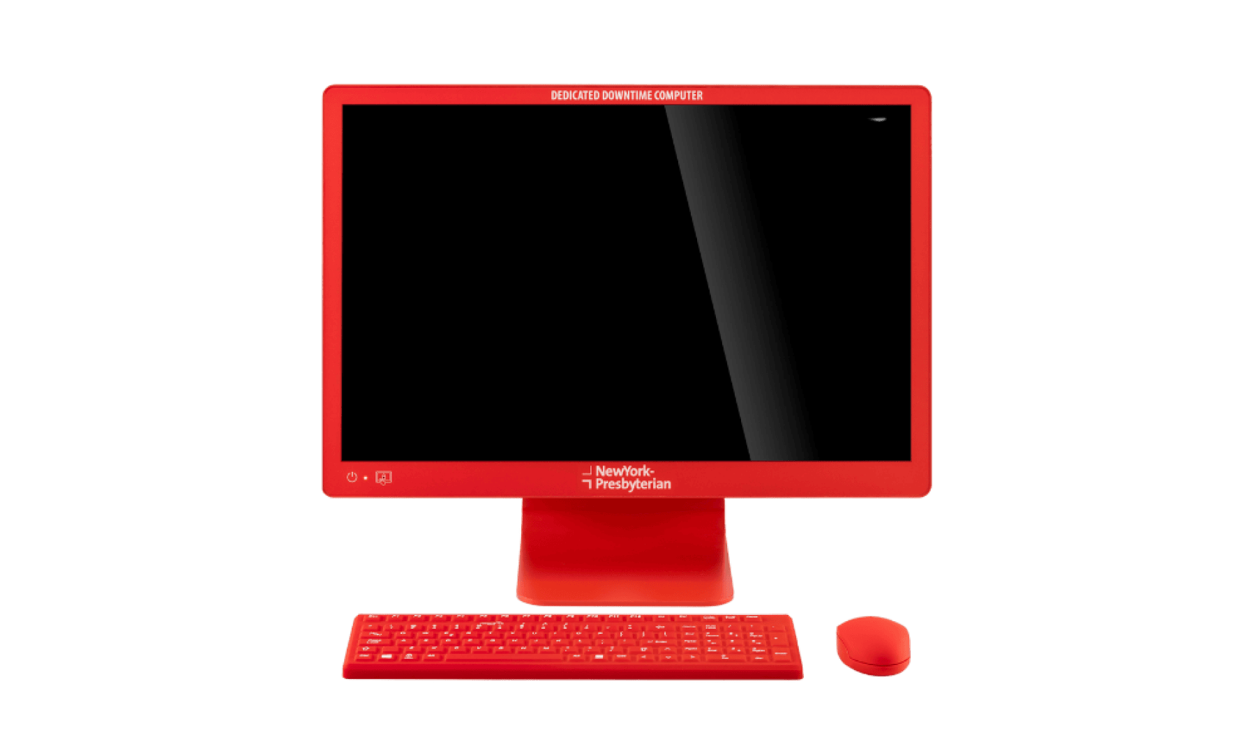 Ein roter Desktop-Computer mit Monitor, Tastatur und Maus. Auf dem Rahmen des Monitors sind die Aufschriften „DEDICATED DOWN TIME COMPUTER“ und „NewYork-Presbyterian“ zu sehen. Der Bildschirm ist leer.