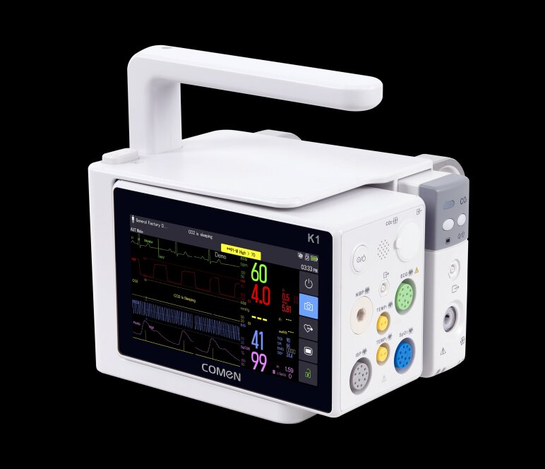 Le moniteur patient Comen K1 affiche sur un écran numérique les paramètres vitaux tels que la fréquence cardiaque, les valeurs de CO₂ et la saturation en oxygène.